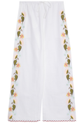 White pants with floral embroidery on a white background