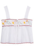 White top with floral embroidery on a white background