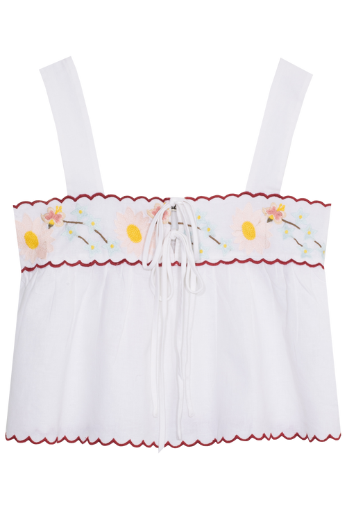 White top with floral embroidery on a white background