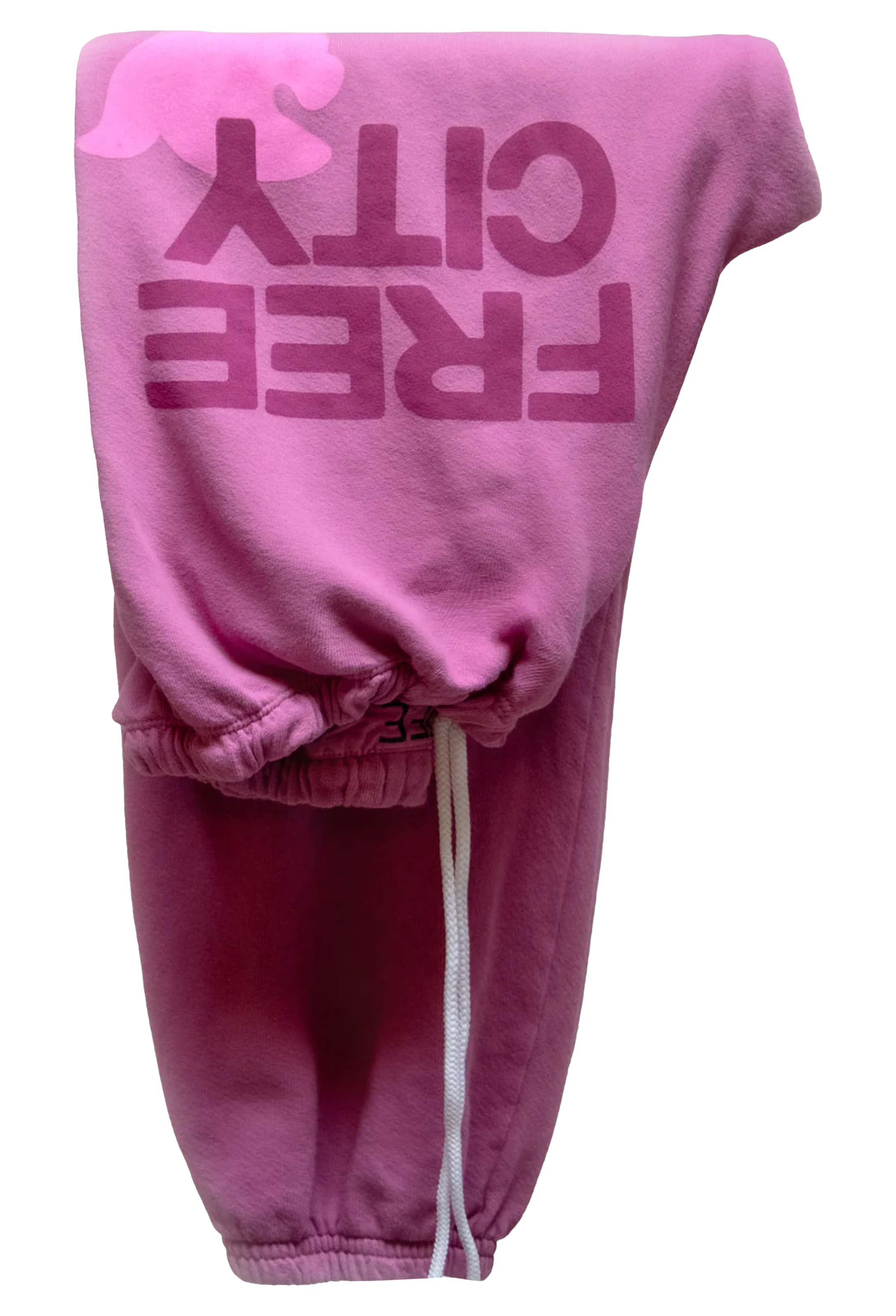Pink sweatpants with 'FREE CITY' text on a white background