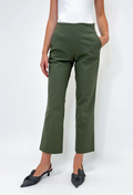 Person wearing green pants on a white background