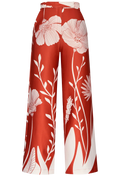 Red pants with white floral pattern on a white background