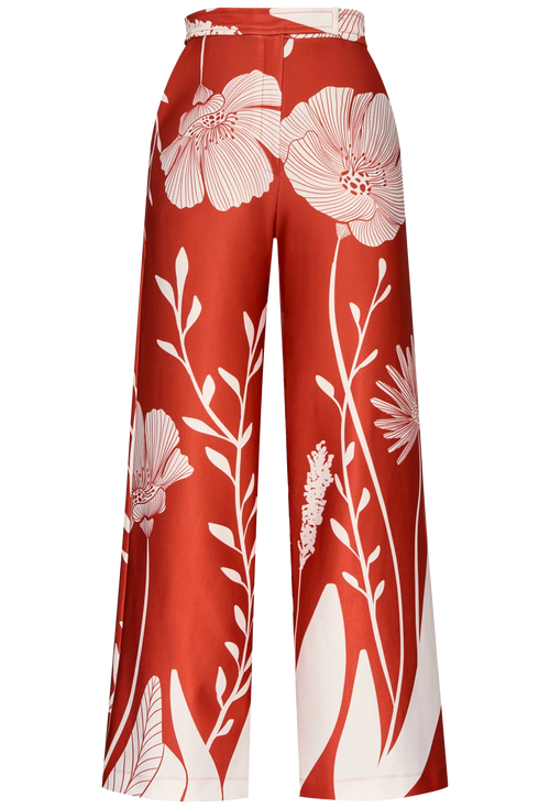 Red pants with white floral pattern on a white background