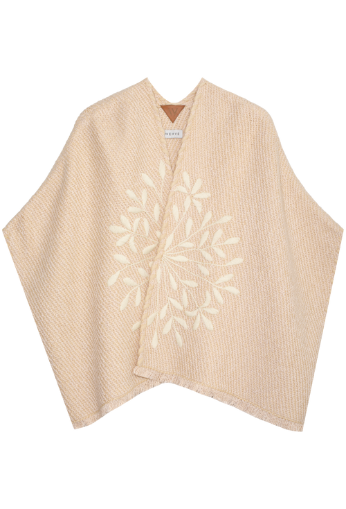 Beige cardigan with floral embroidery on a white background