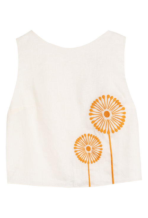 White tank top with orange designs on a white background