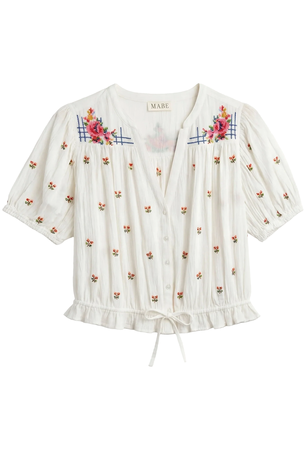 White blouse with floral embroidery on a white background