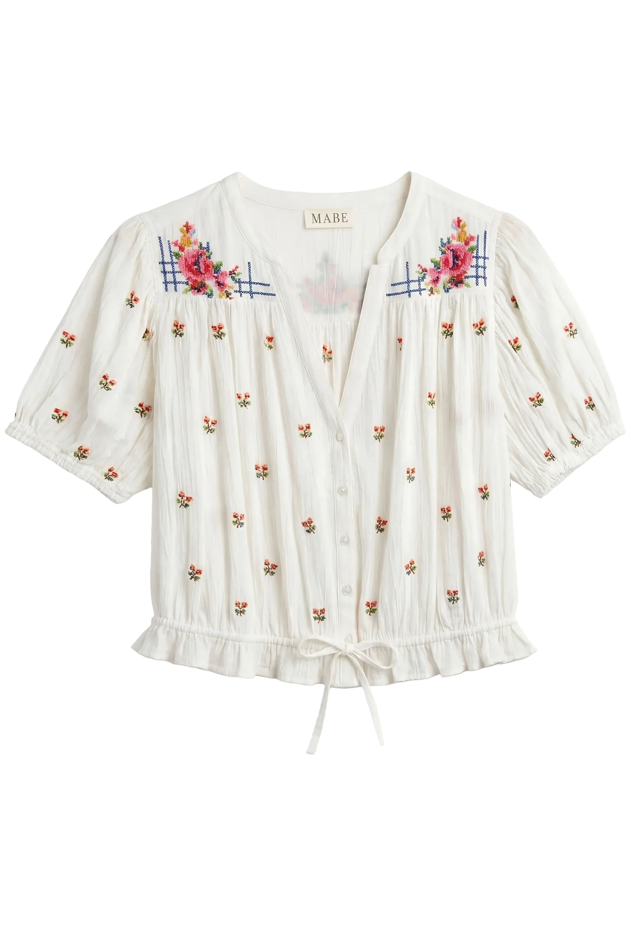White blouse with floral embroidery on a white background