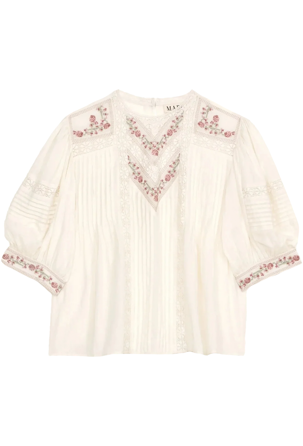 White blouse with floral embroidery on a white background
