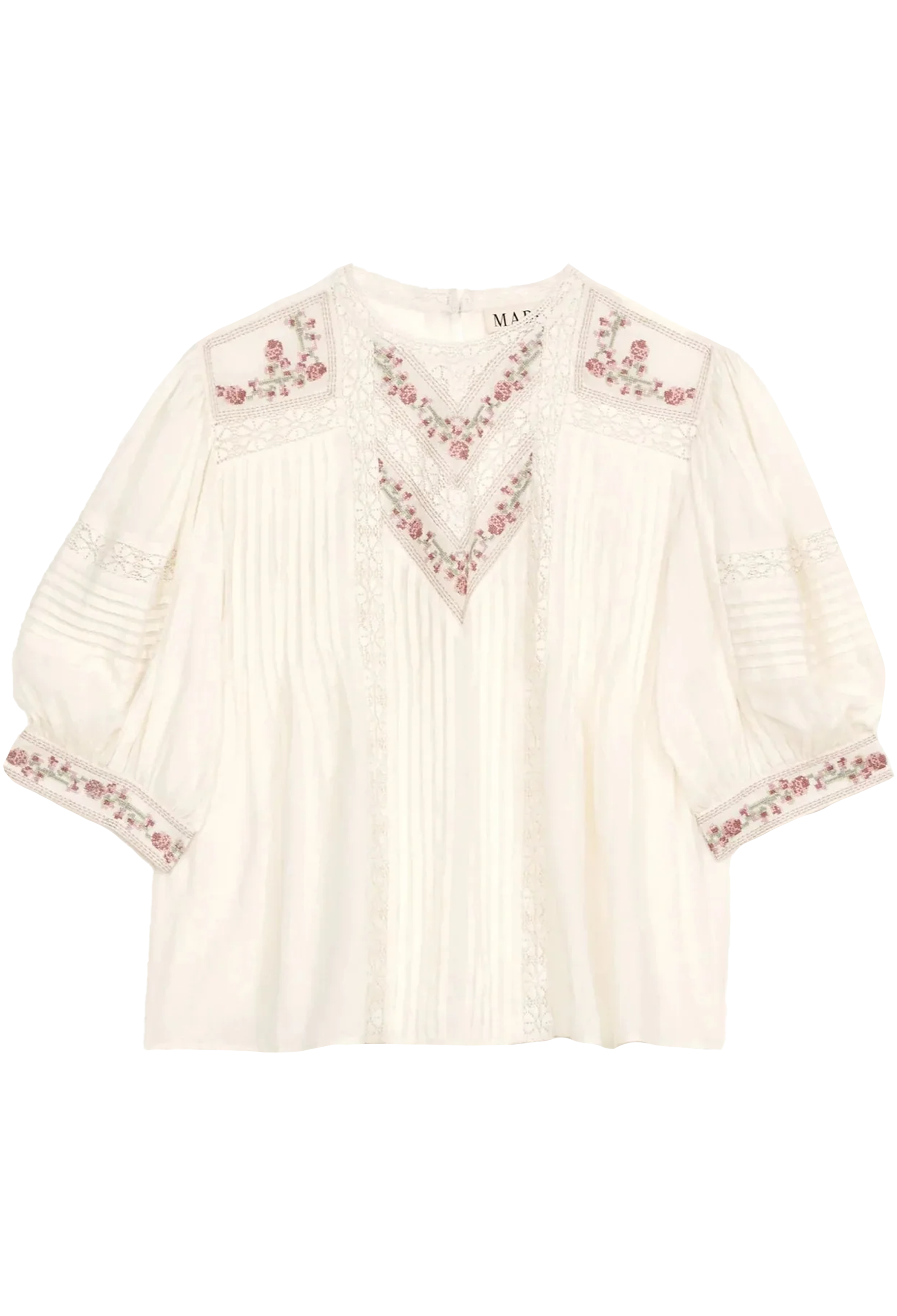White blouse with floral embroidery on a white background