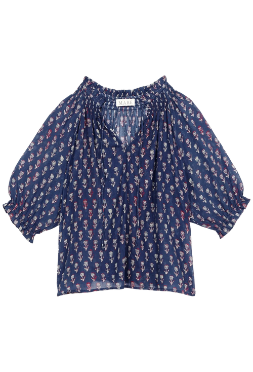 Blue patterned blouse on a white background