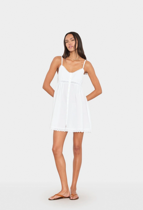 Woman wearing a white dress on a white background