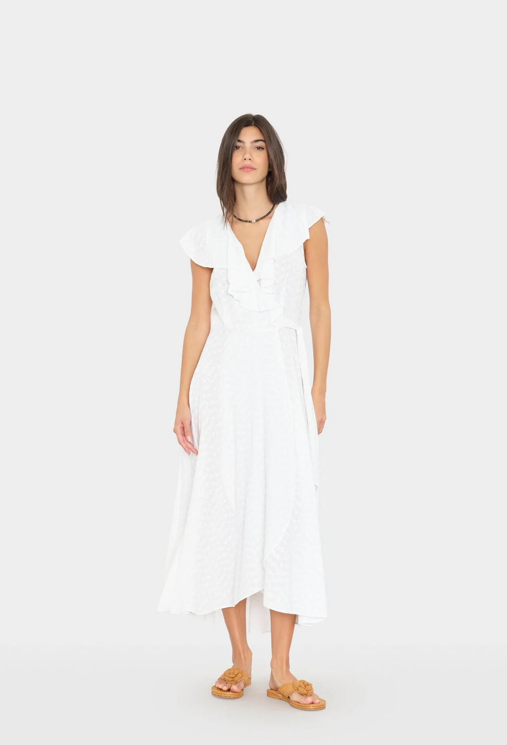 Woman wearing a white dress on a white background