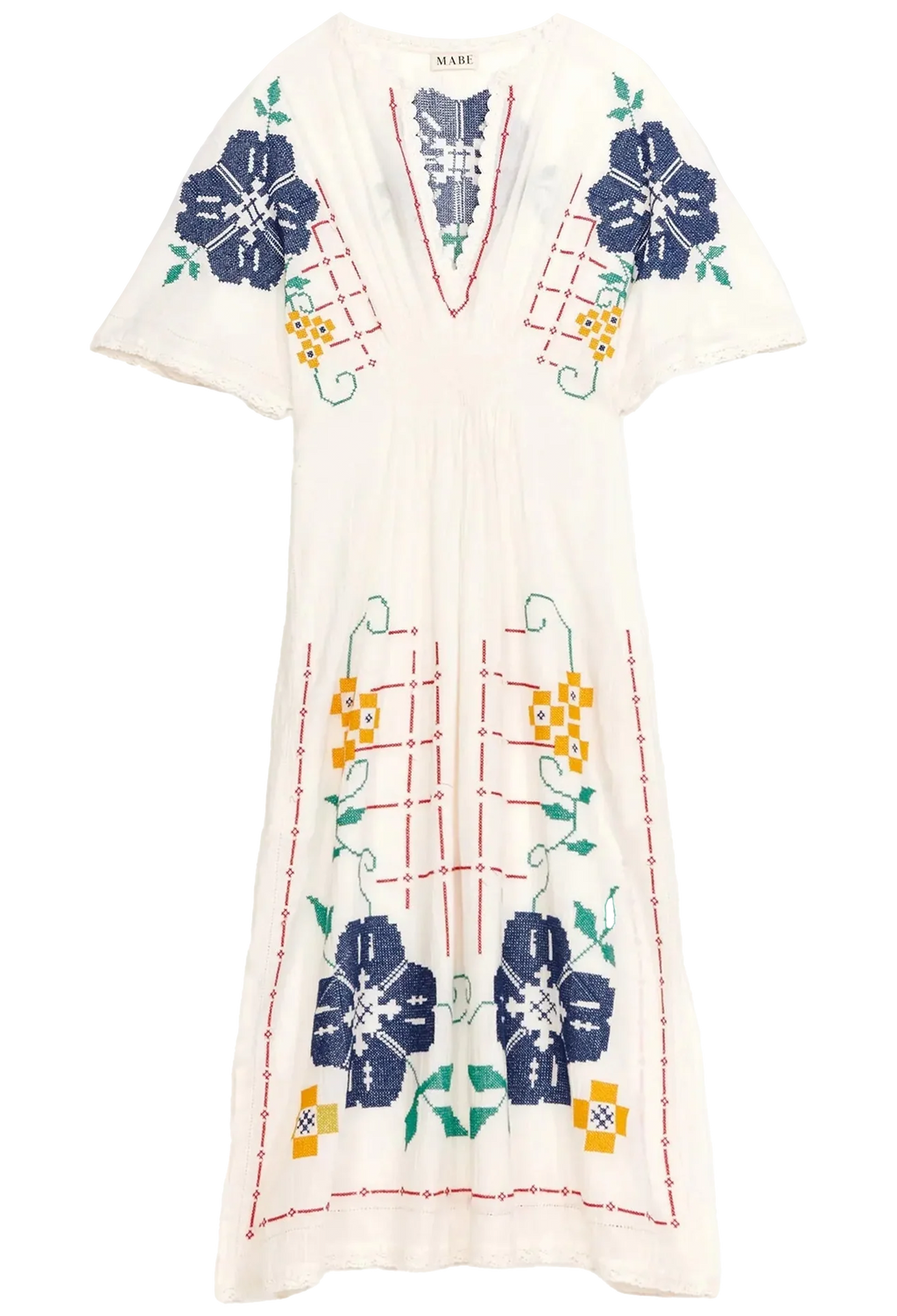 White dress with colorful floral and geometric patterns on a white background