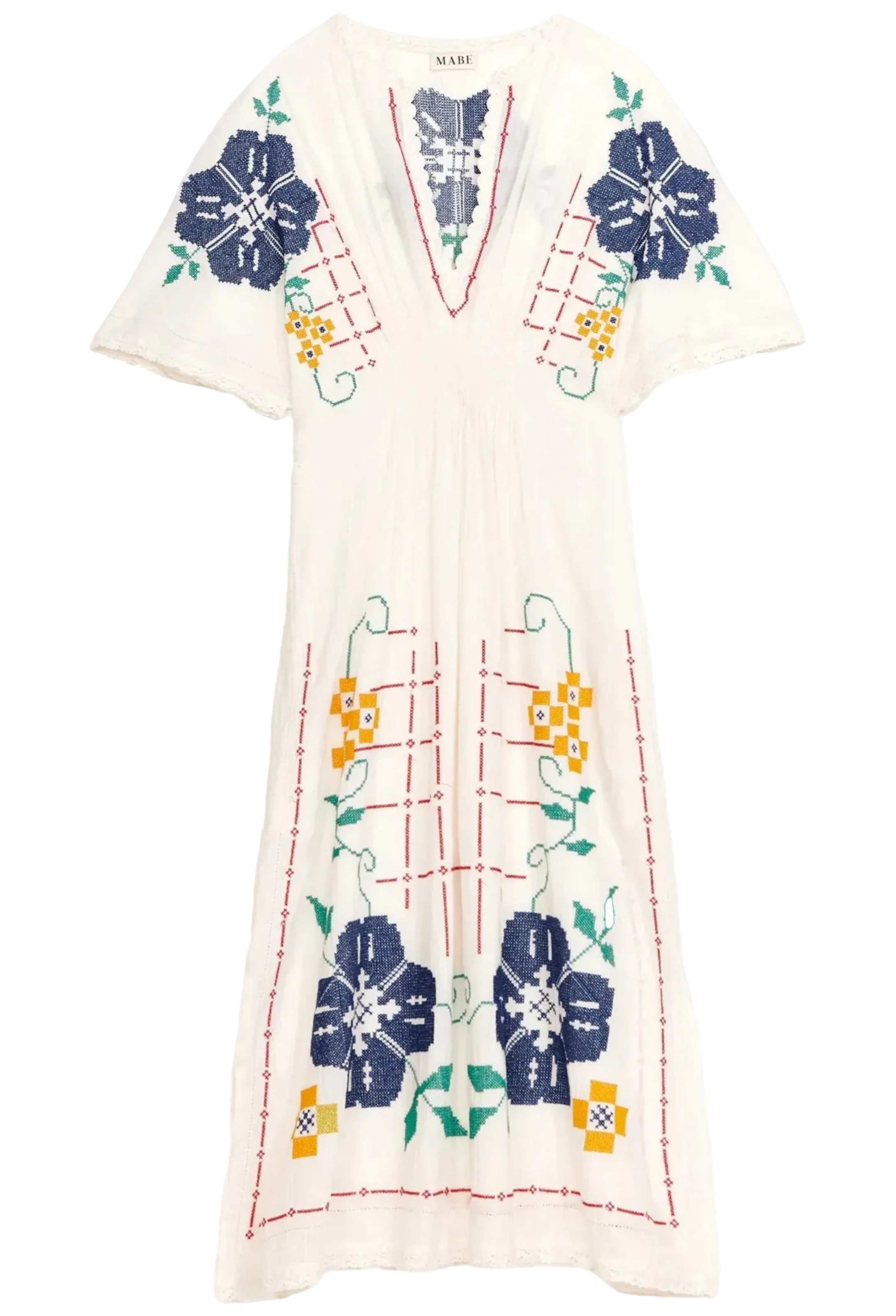 White dress with colorful floral and geometric patterns on a white background