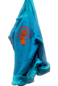 Blue sweatshirt with orange graphic design on a white background