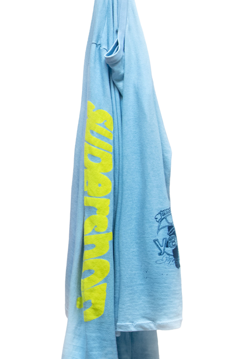Light blue t-shirt with yellow text and graphics on a white background