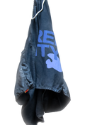 Blue shorts hanging against a white background