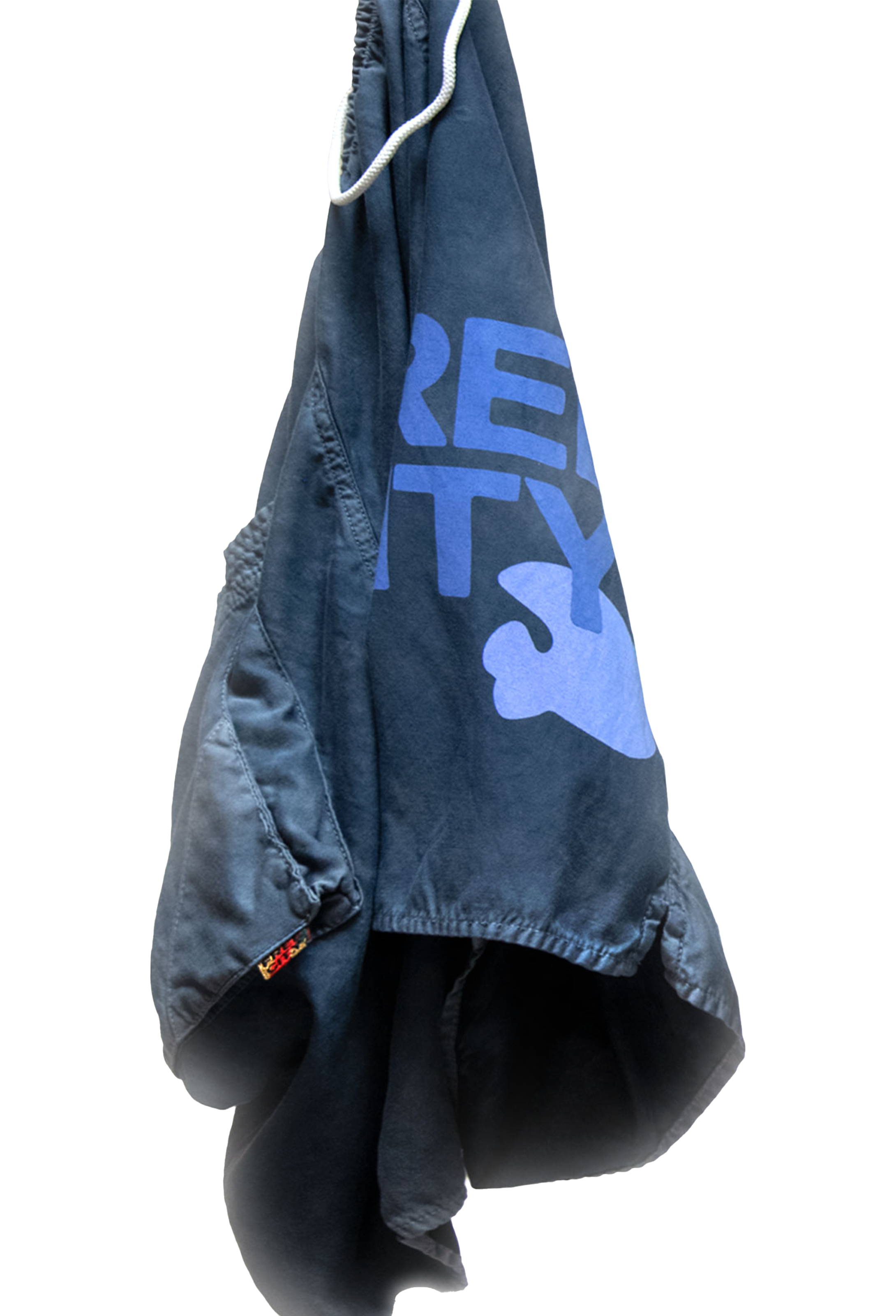 Blue shorts hanging against a white background