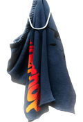 Blue shorts with colorful text hanging on a white background