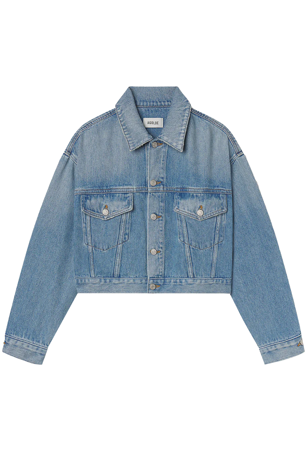 model wearing jeans and a denim jacket on a white background