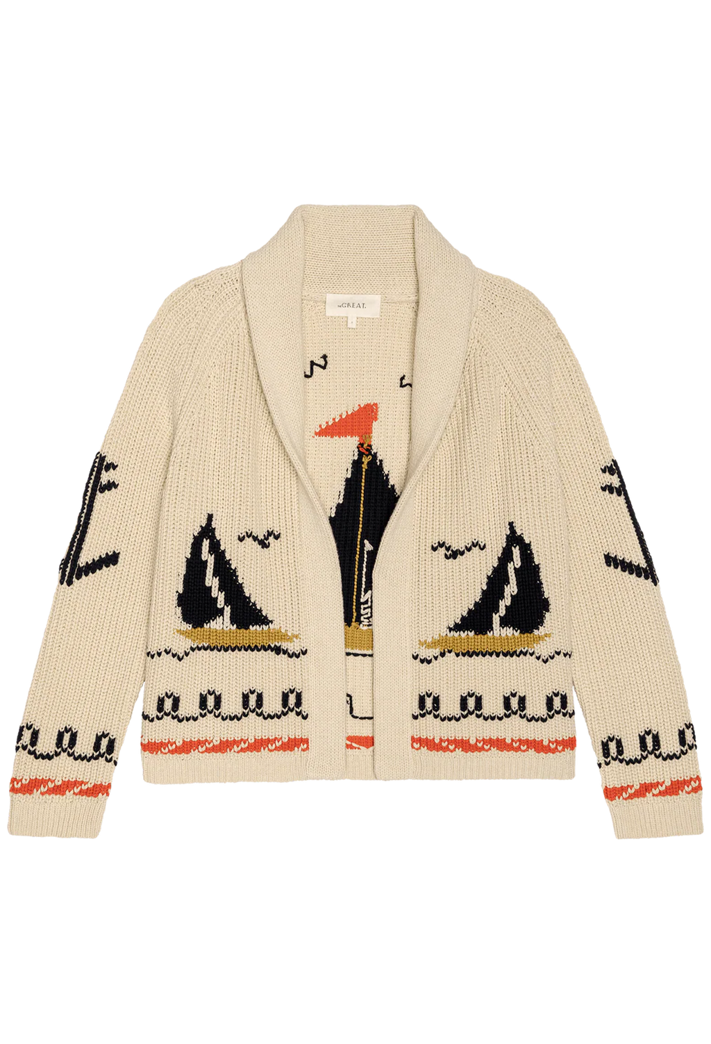 beige cardigan with embroidered sailboat motifs on a white background