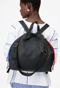 Person wearing a black backpack on a white background