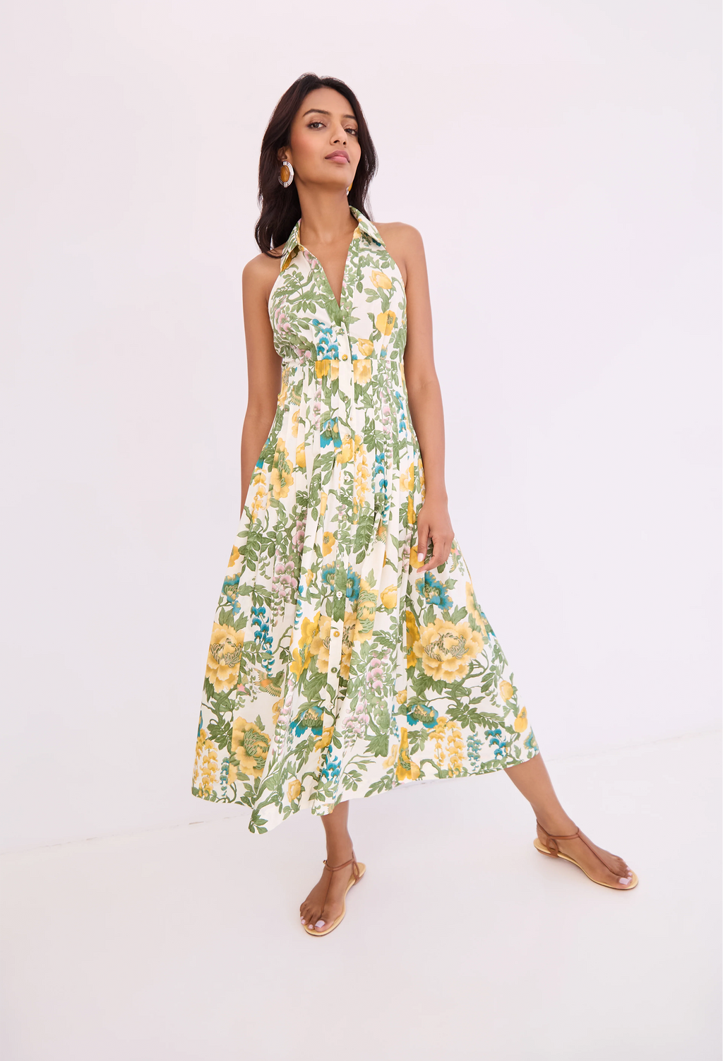 Woman wearing a floral dress on a white background