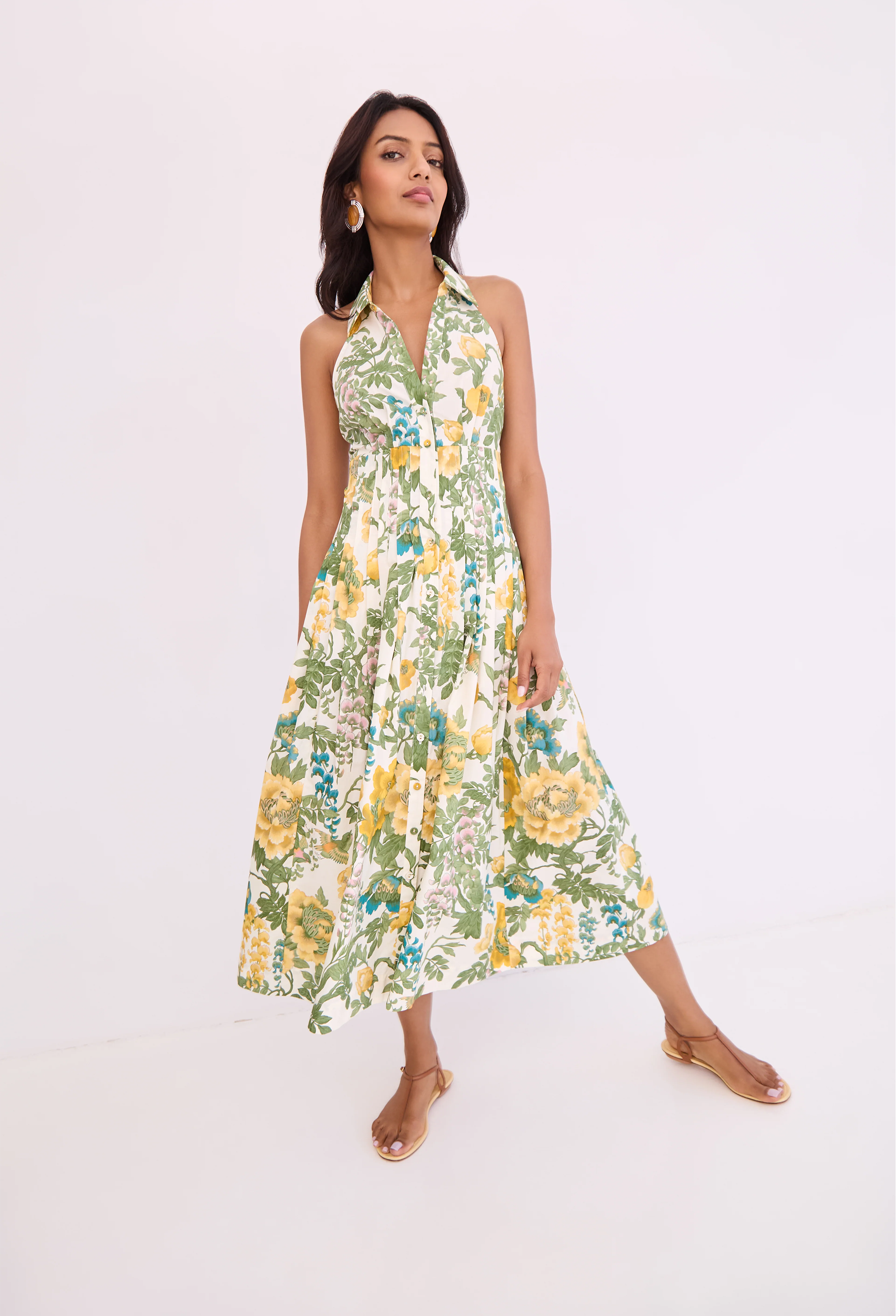 Woman wearing a floral dress on a white background