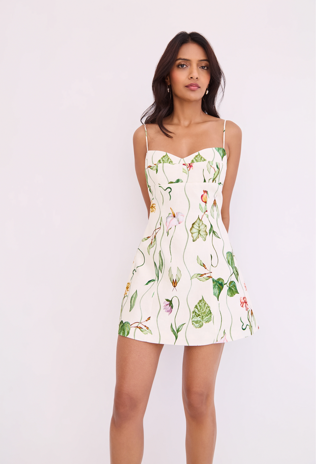 Woman wearing a floral dress on a white background
