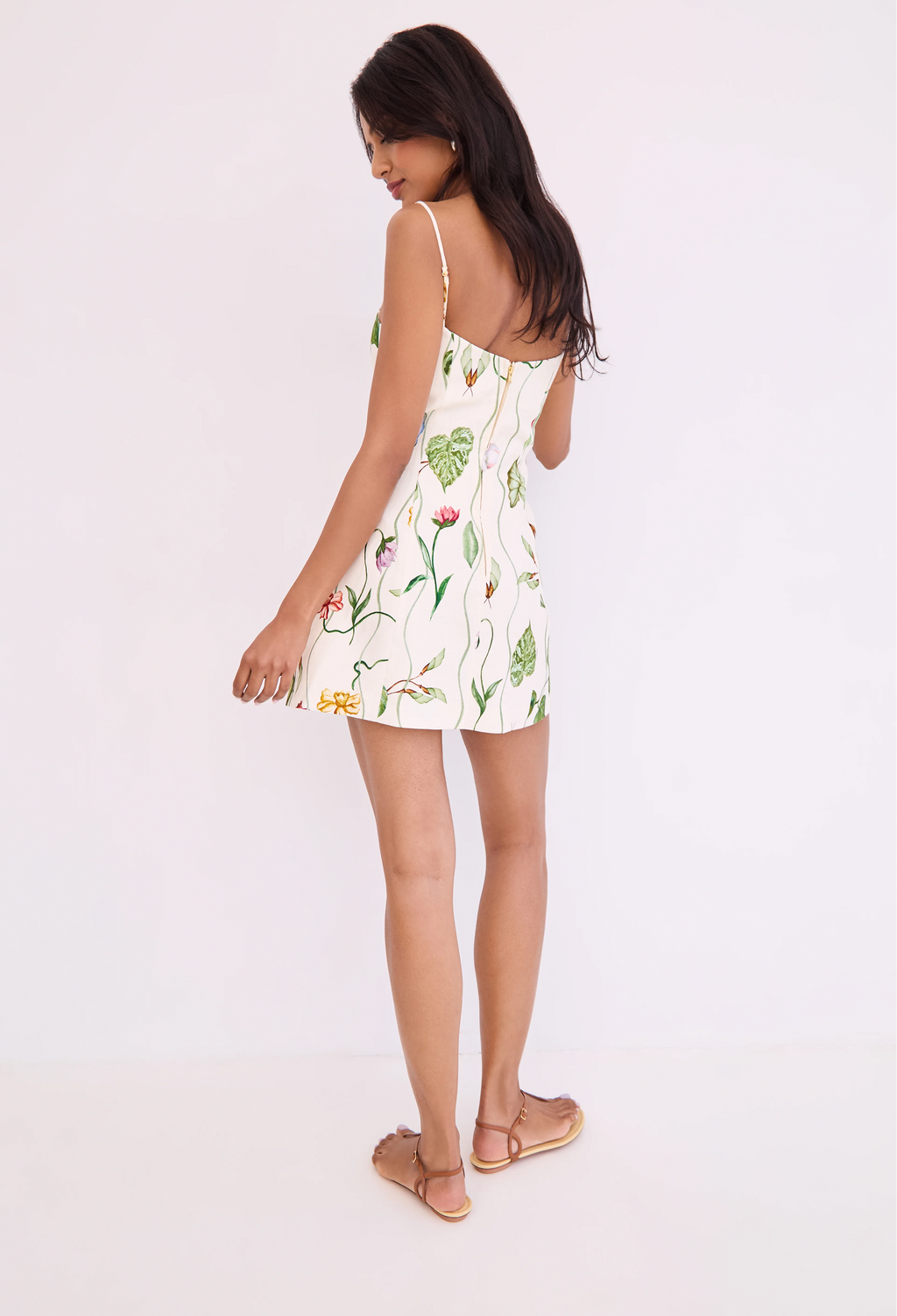 Woman wearing a floral dress on a white background