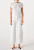 Person wearing a white t-shirt and white jeans on a white background