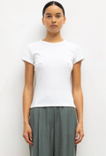 Person wearing a plain white t-shirt and gray pants on a white background