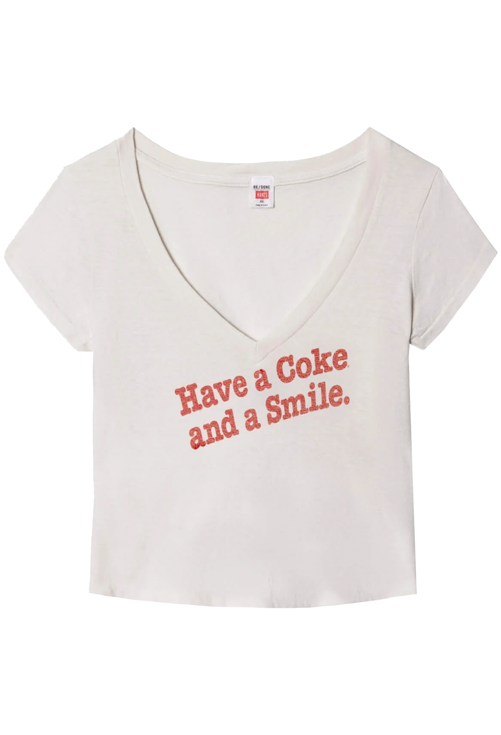 White t-shirt with red text 'Have a Coke and a Smile' on a white background