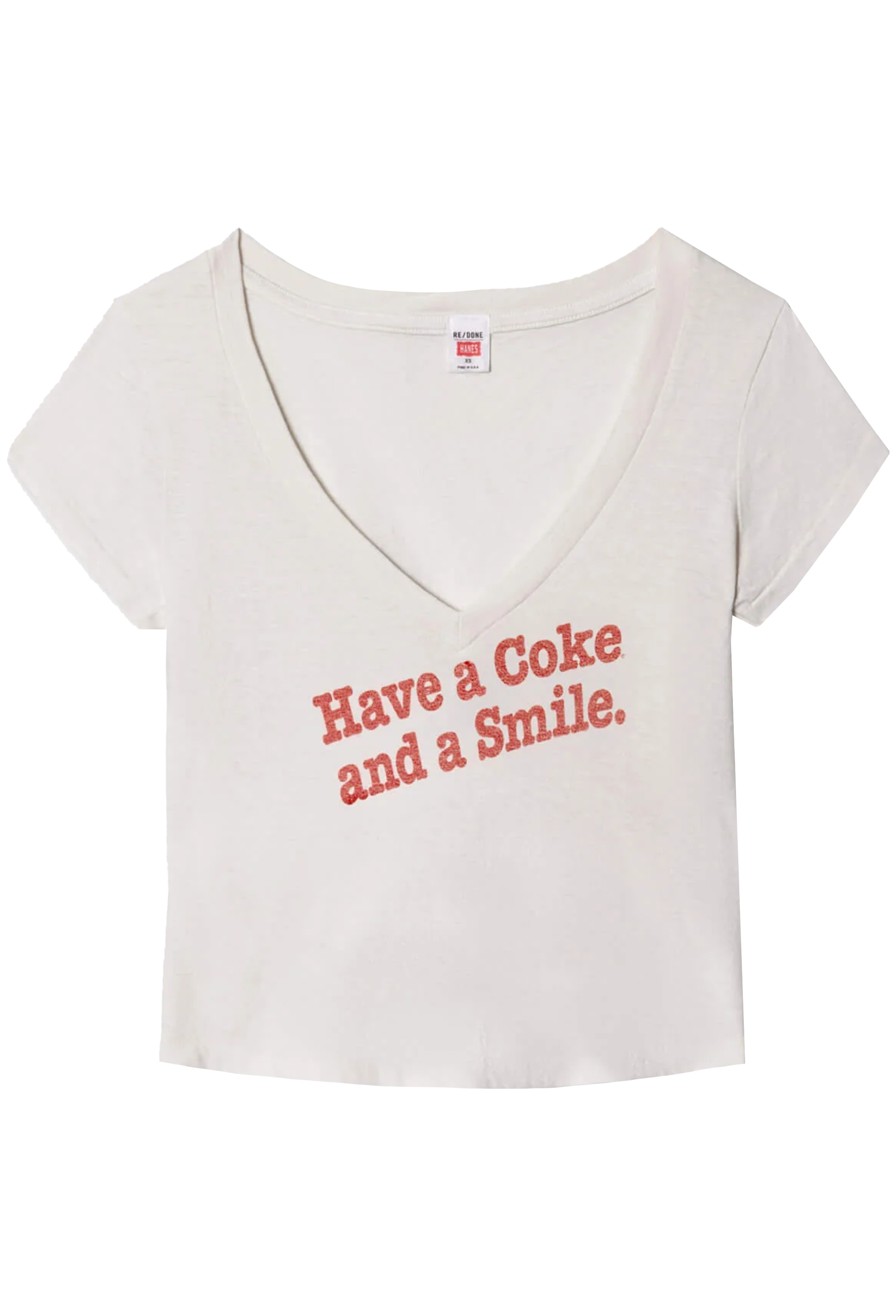 White t-shirt with red text 'Have a Coke and a Smile' on a white background