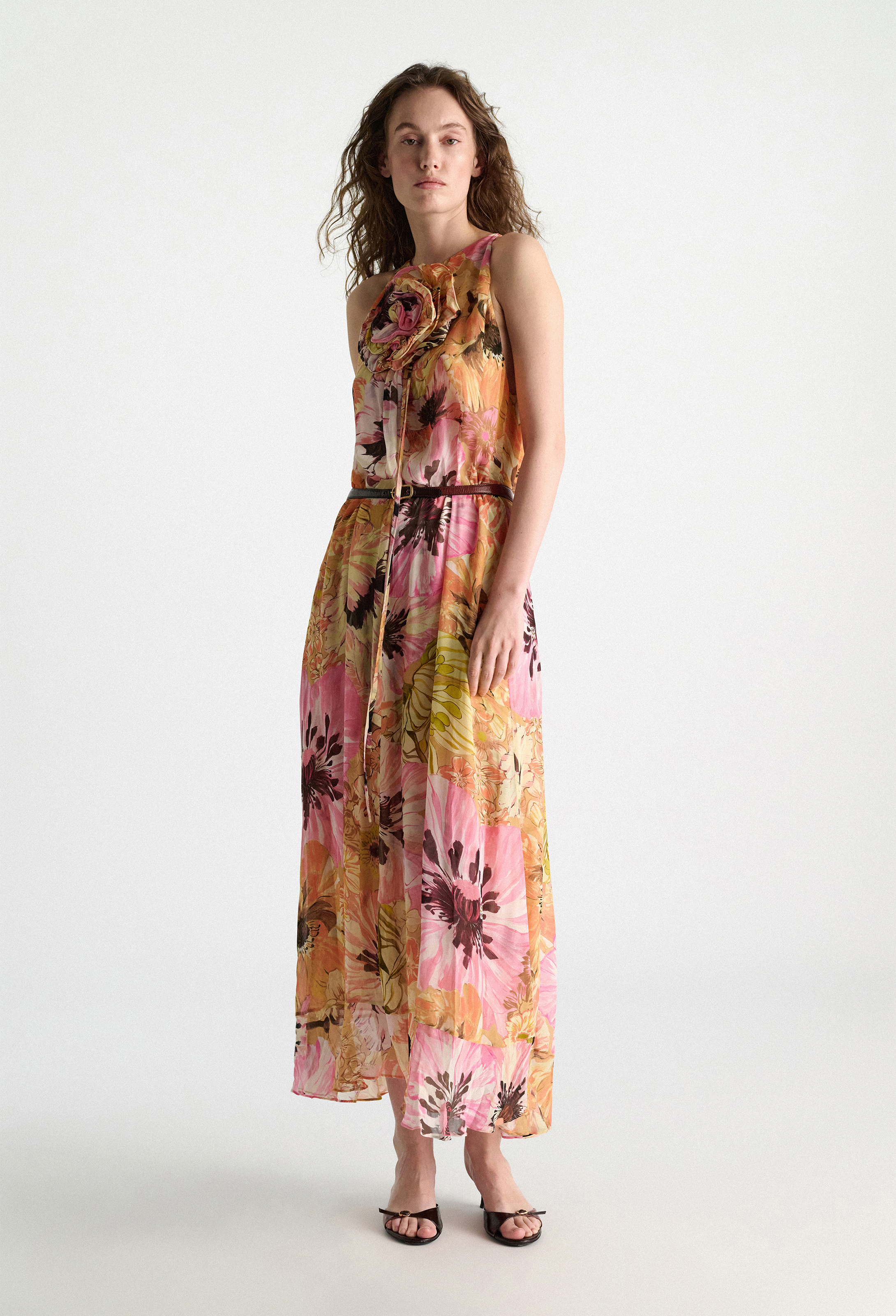 Woman wearing a floral dress on a white background