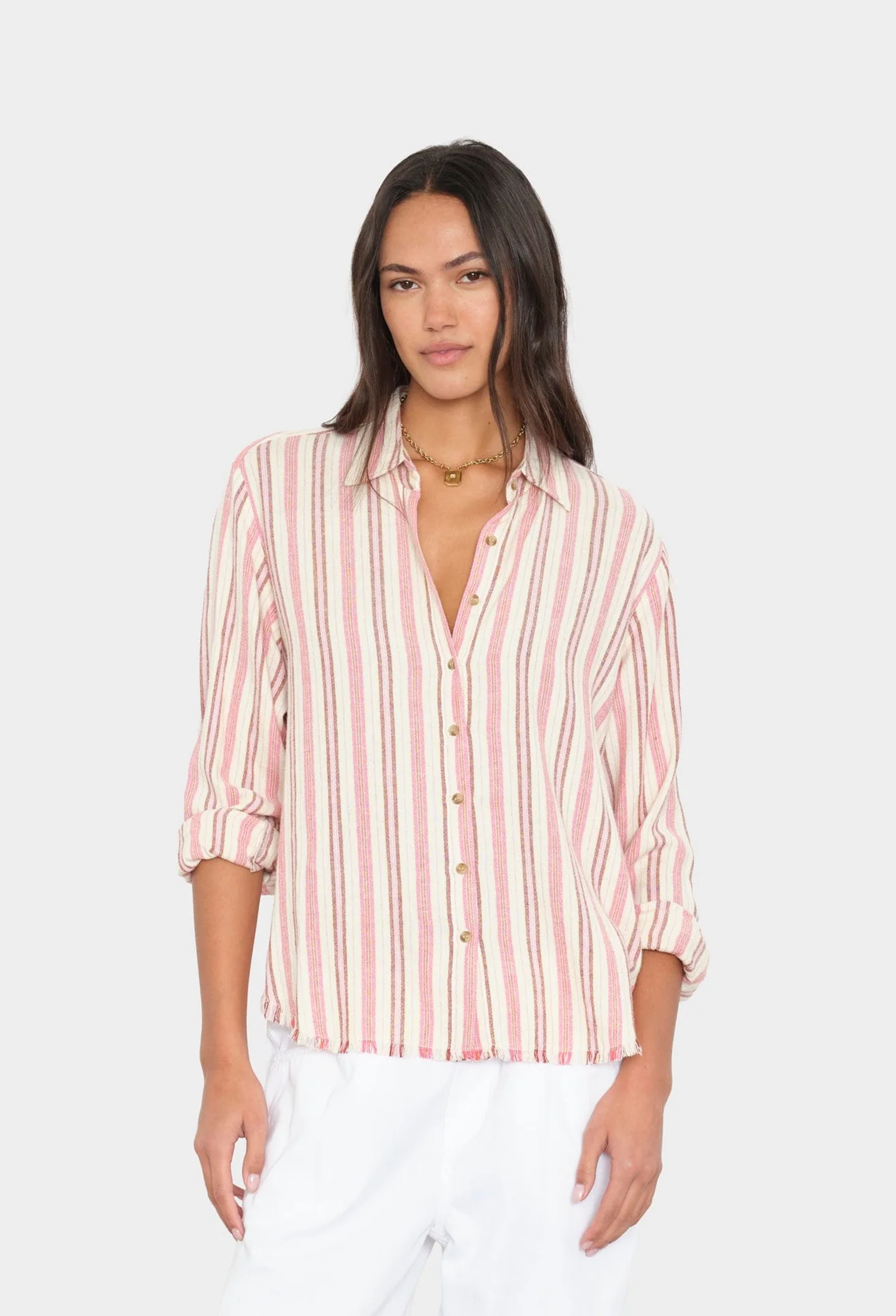 Woman wearing a pink and white striped shirt on a white background