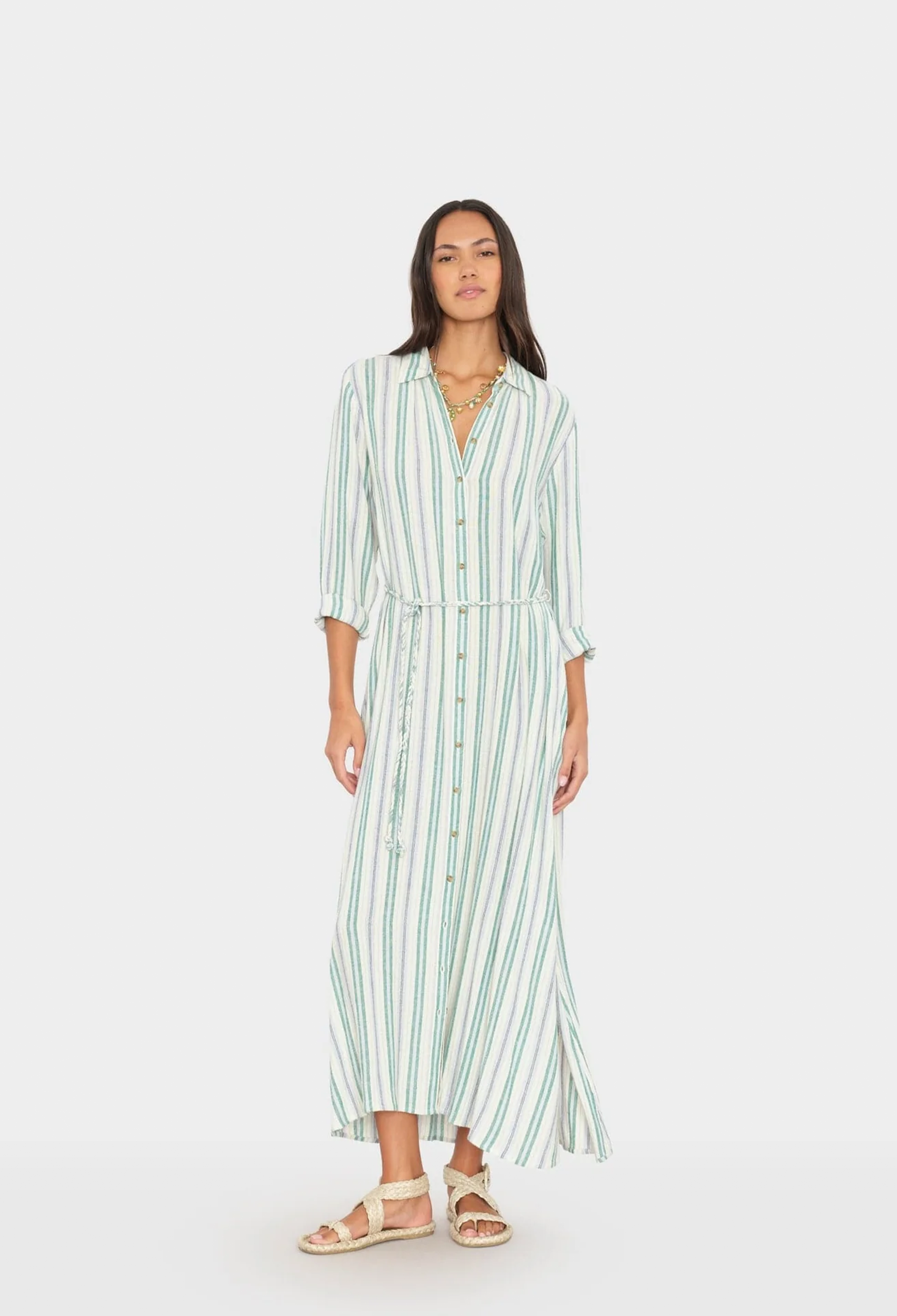 Woman wearing a striped dress on a white background