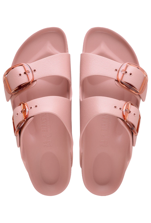 Pair of pink sandals with gold buckles on a transparent background