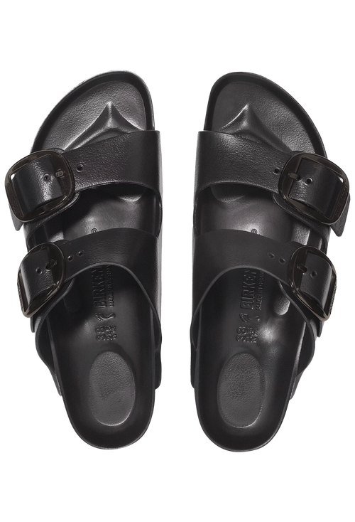Pair of black sandals with buckles on a transparent background