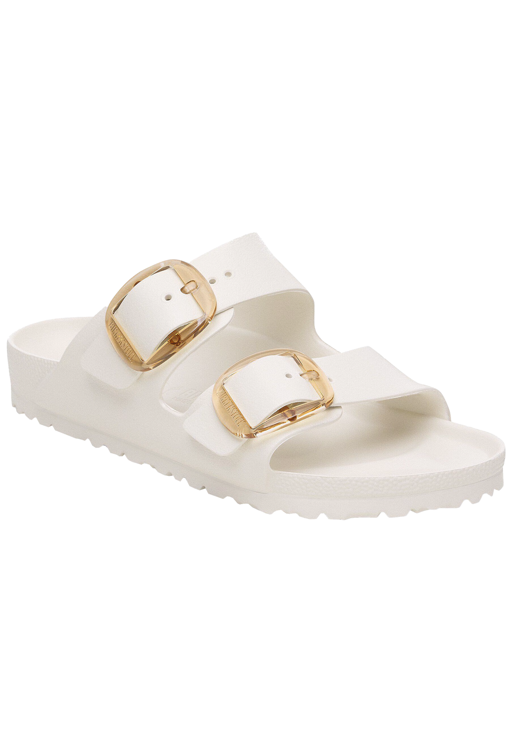 White sandal with gold buckles on a white background