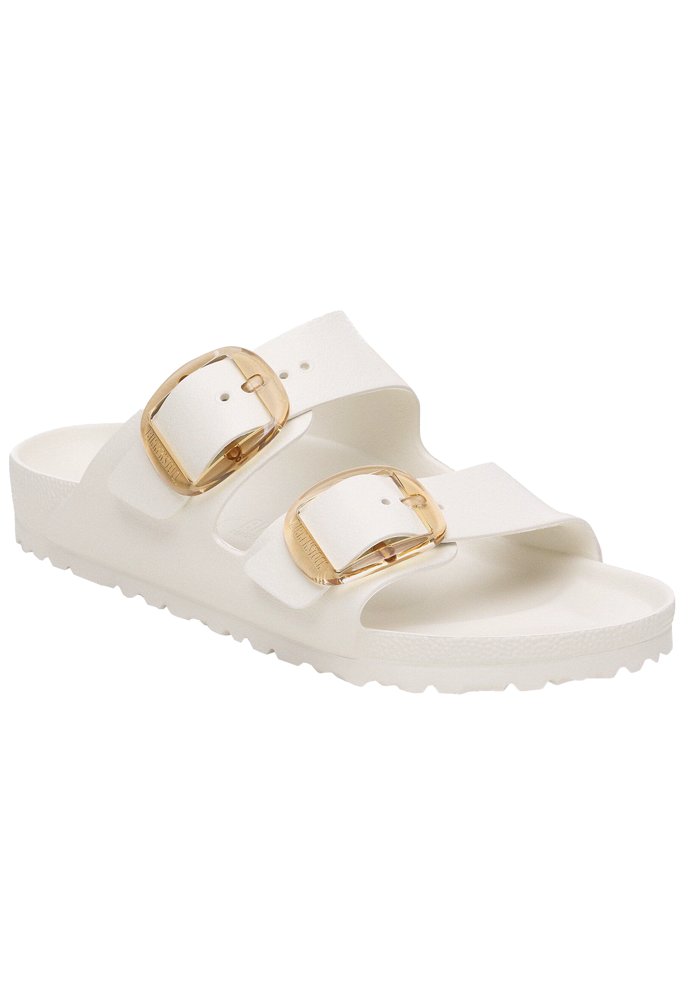 White sandal with gold buckles on a white background