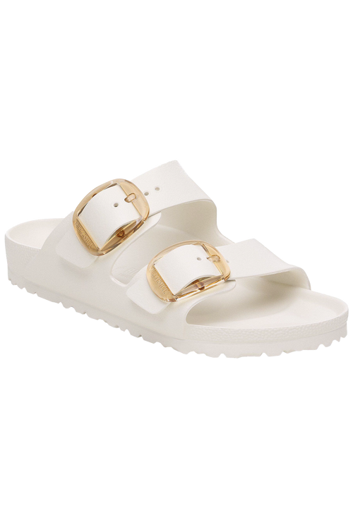 White sandal with gold buckles on a white background