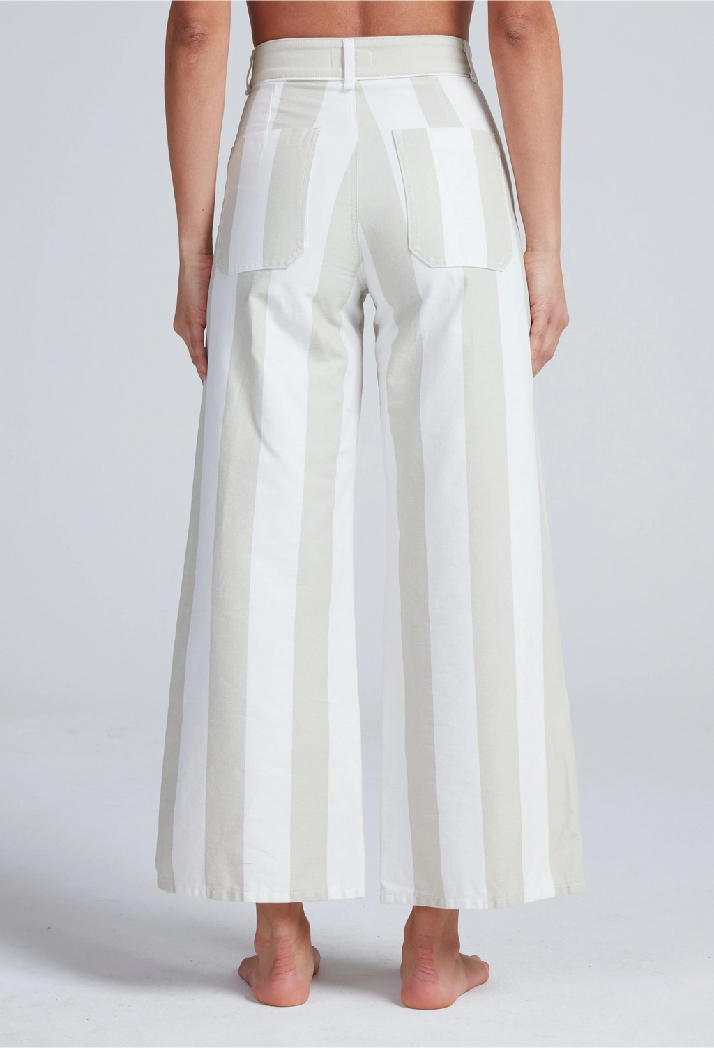 White wide-leg pants worn by a person on a plain background