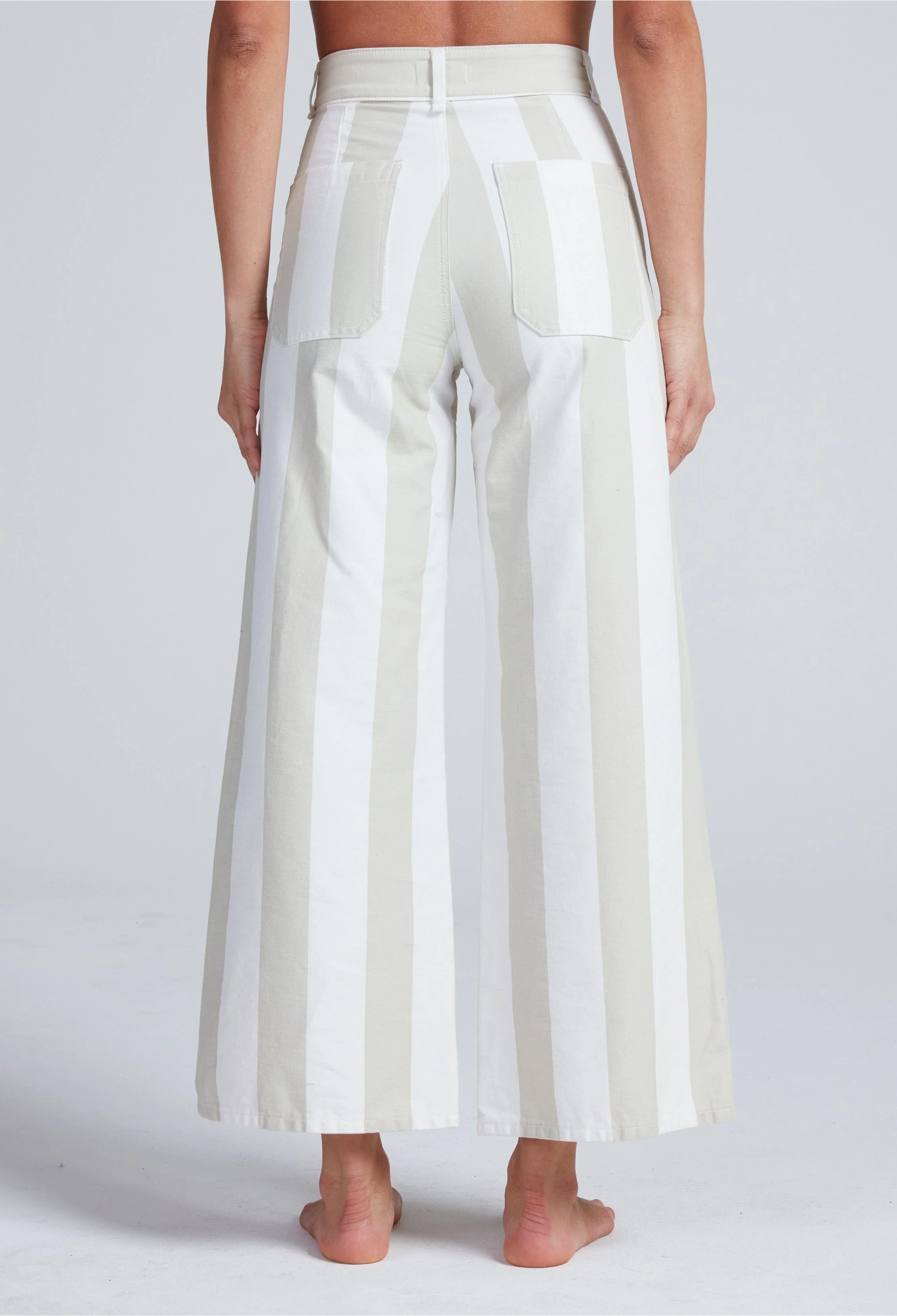 White wide-leg pants worn by a person on a plain background