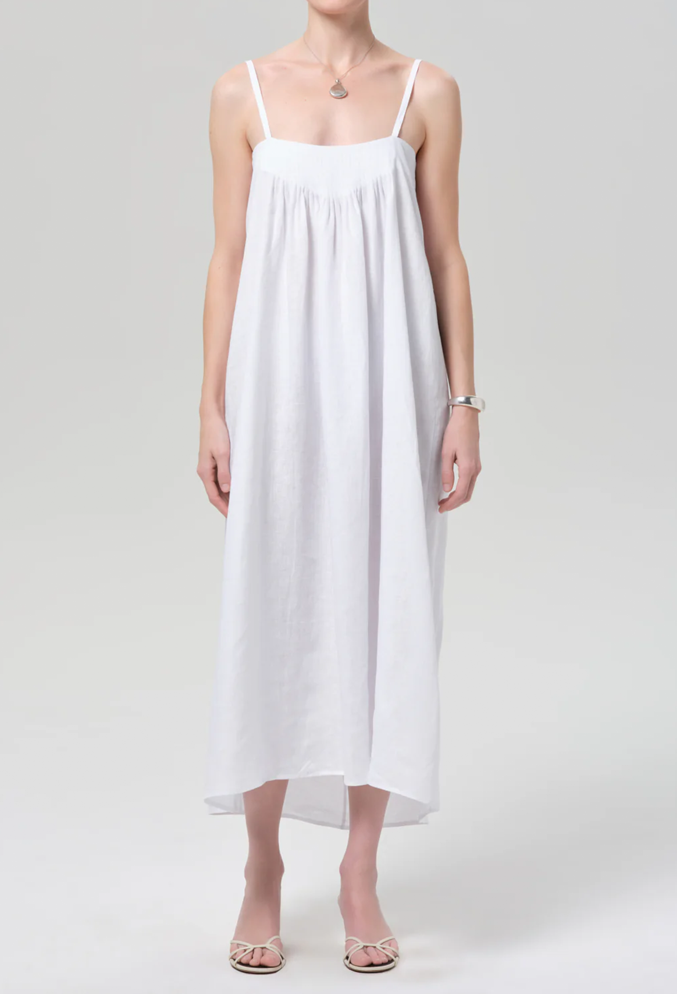 White dress worn by a person on a white background