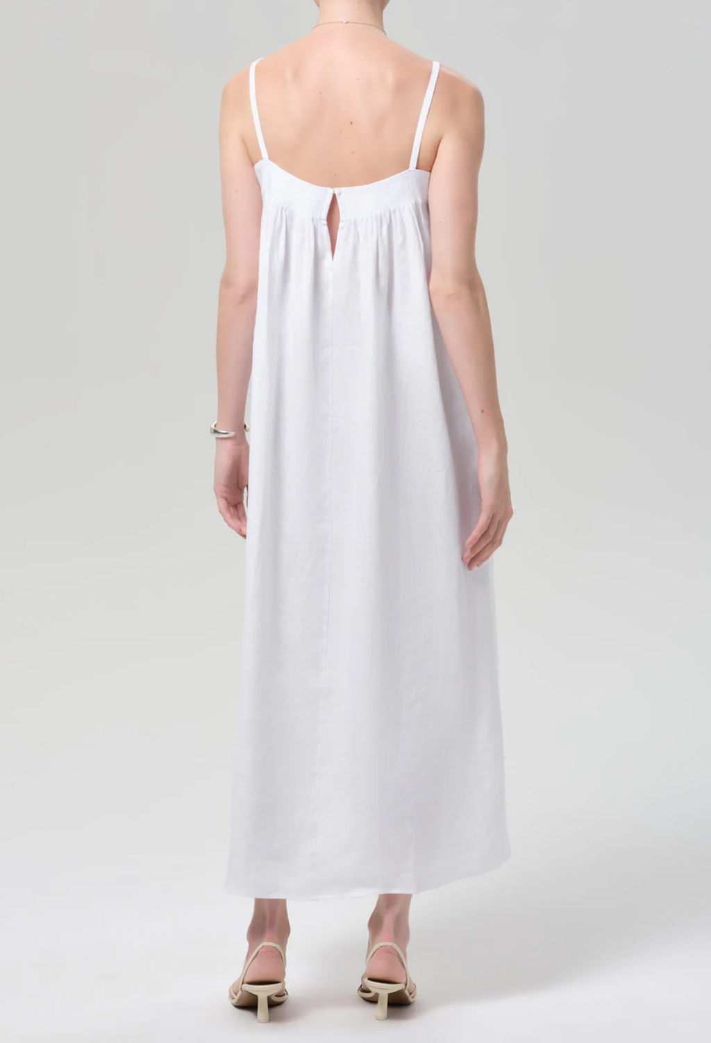 White dress worn by a person on a white background