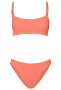 Coral bikini set on a white background