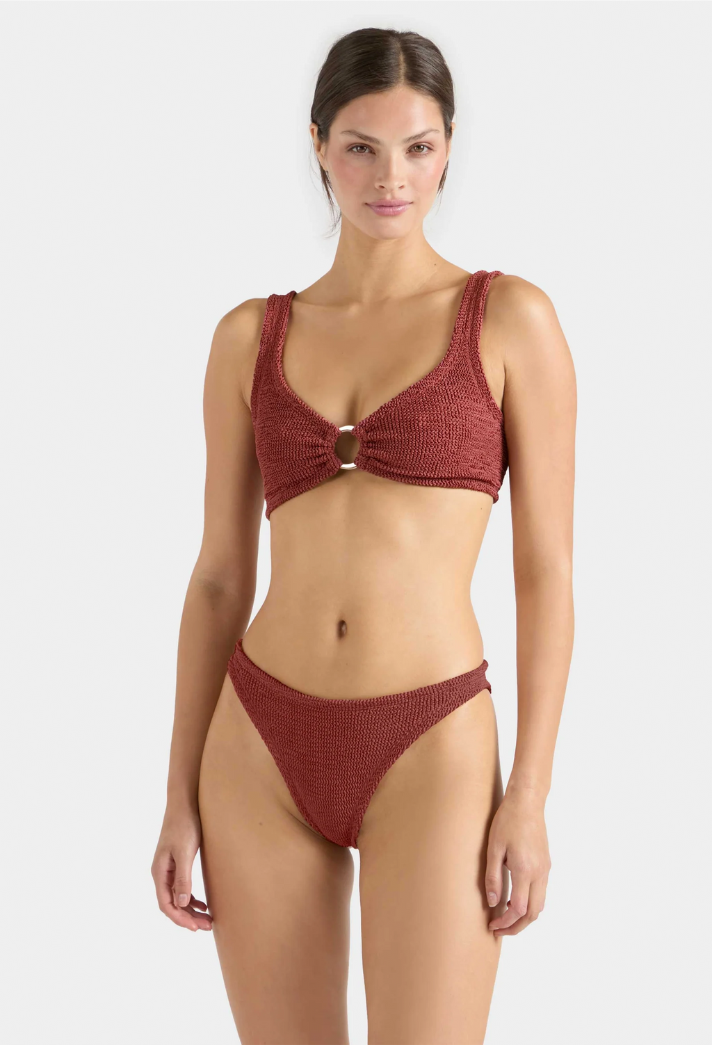 Woman wearing a red bikini on a white background