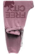 Pink sweatpants with 'FREE CITY' text on a white background
