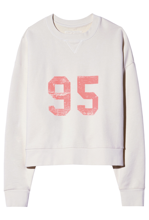 White sweatshirt with pink '95' print on a white background